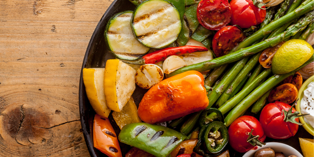 High angle view of bounty of colorful grilled vegetables.