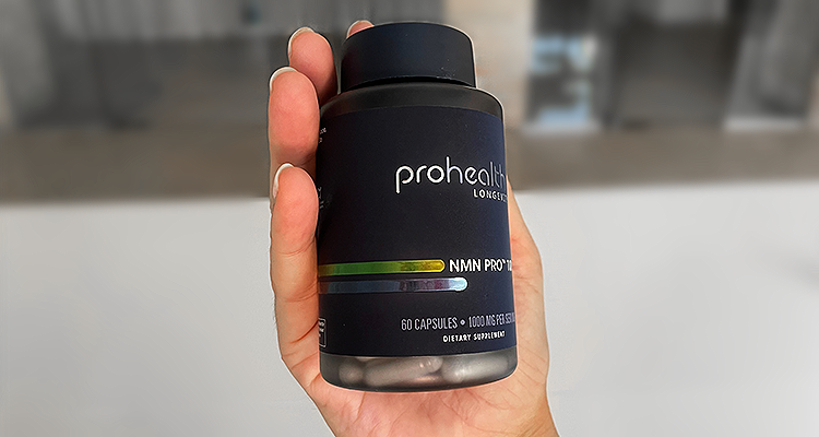 Hand holding ProHealth NMN Pro