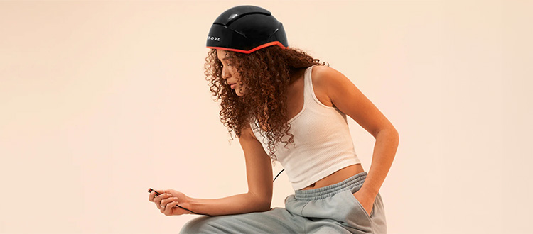 woman using phone wearing irestore<br>