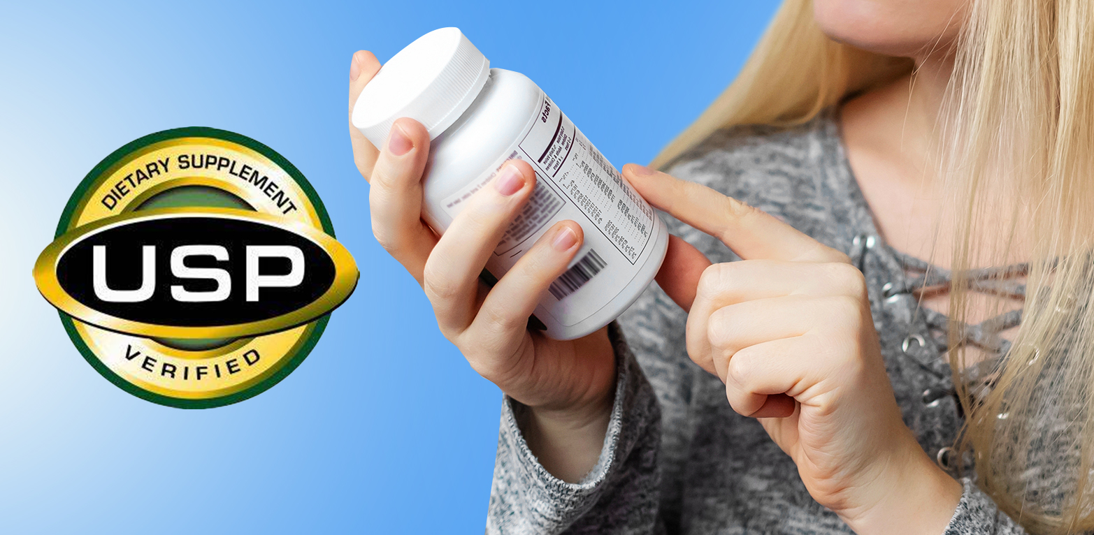 Person holding Magnesium supplement with USP seal