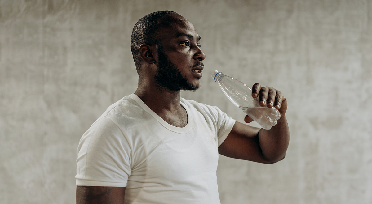 Black person drinking water