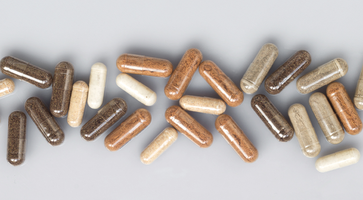 Spermidine supplements set against a grey background