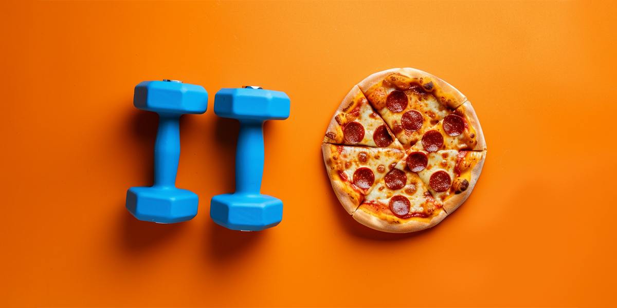Weights and pizza set against an orange background