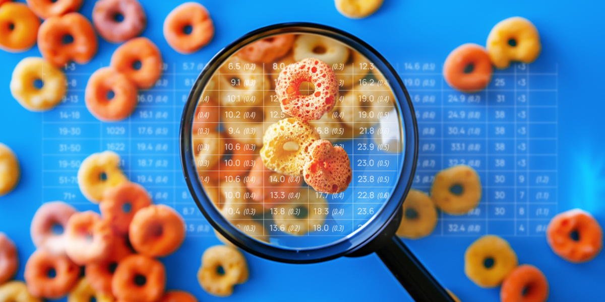 Cereal rings under a magnifying glass set against a blue background