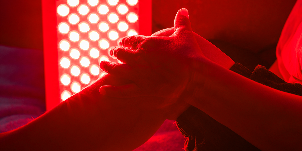 Persons sitting in a red light therapy room