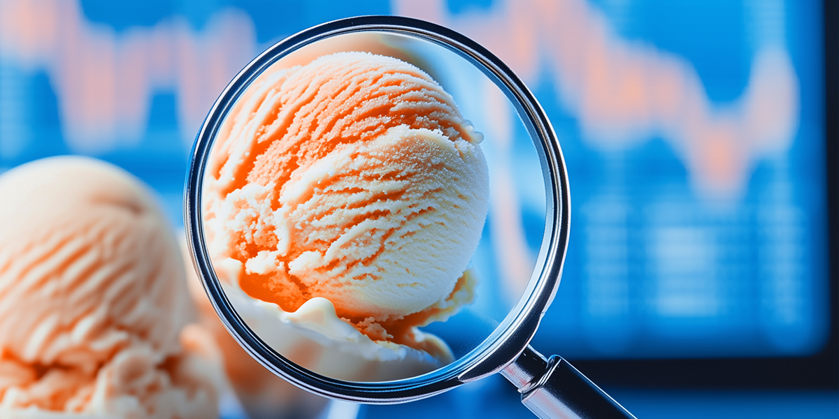 Ice cream under a magnifying glass with a blurred graph in the background