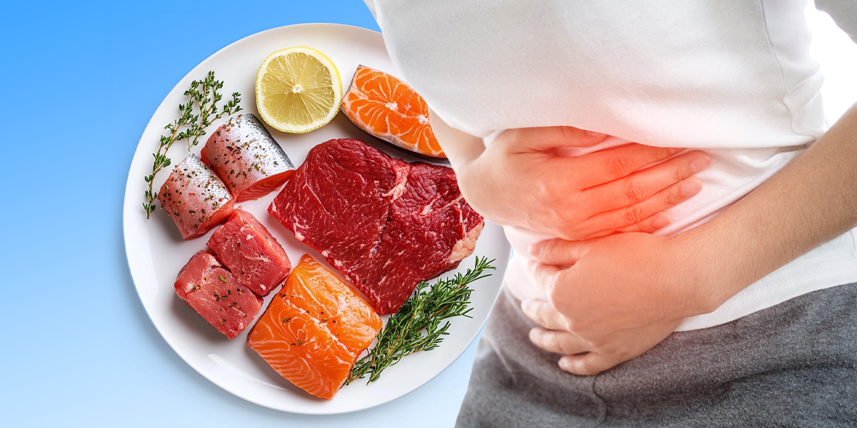 A plate with different types of meat and fish next to a person experiencing stomach ache