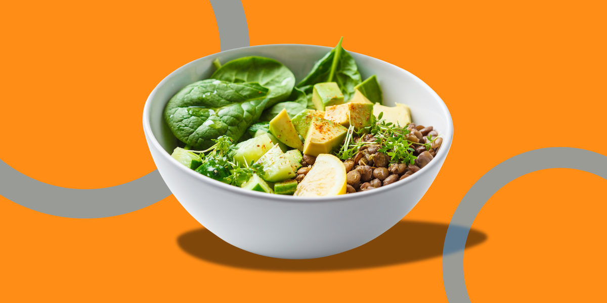 Bowl of lentils, avocado, and greens