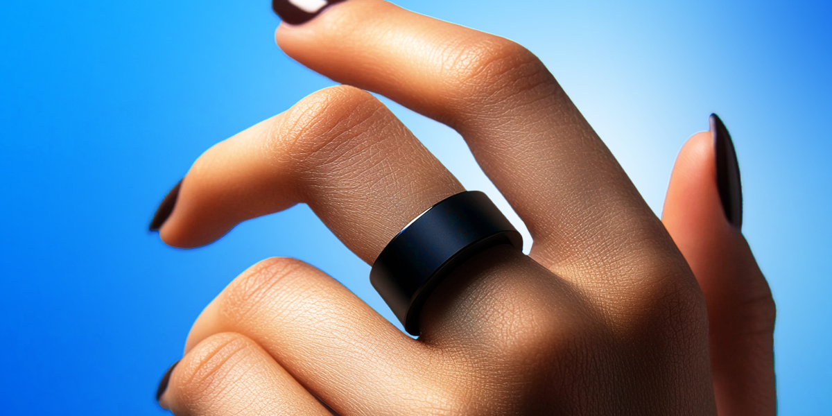 Hand with a smart ring on it's finger in blue background