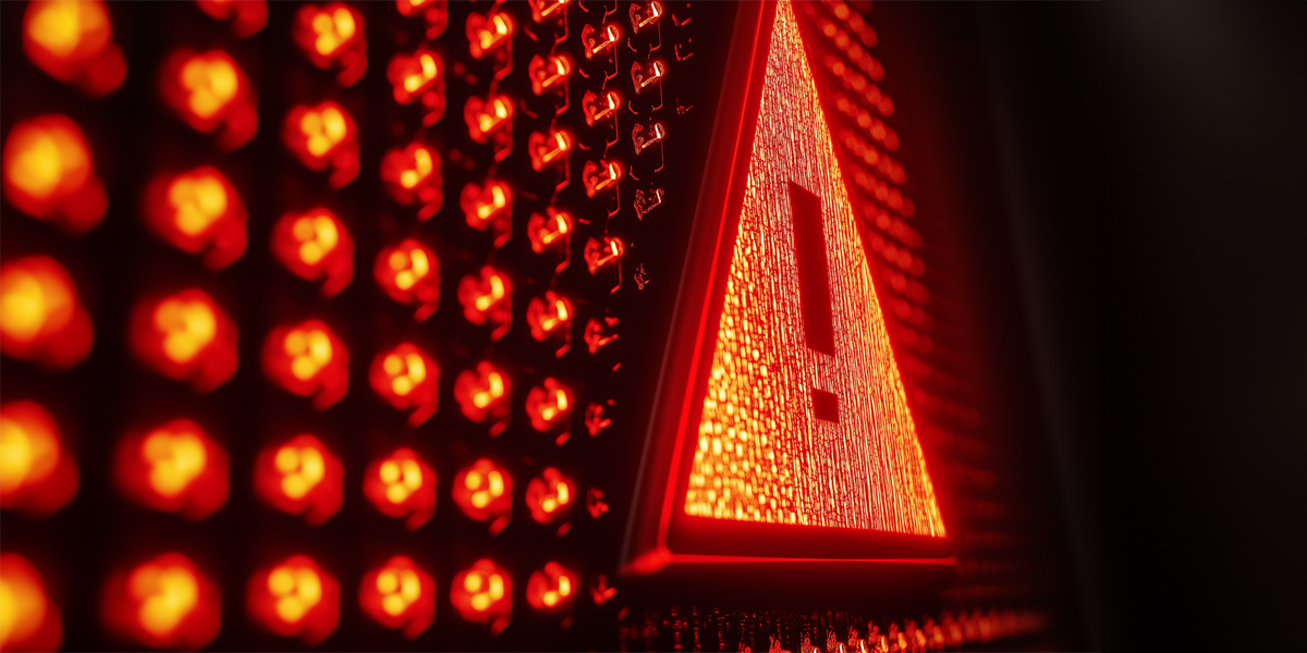 Red light bulbs and a danger sign in them in the dark
