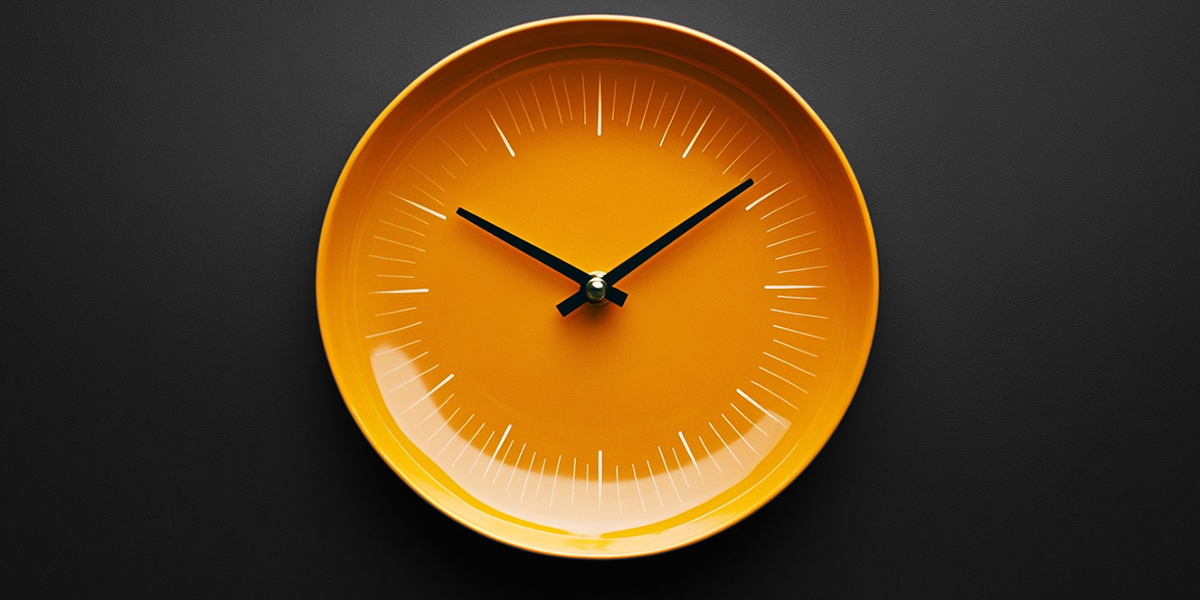 Orange clock in black background