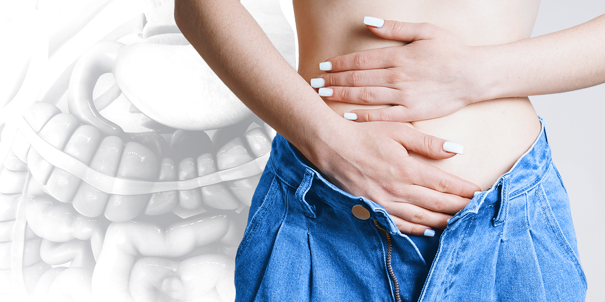 Person feeling their abdomen for ibs symptoms, gut in the background