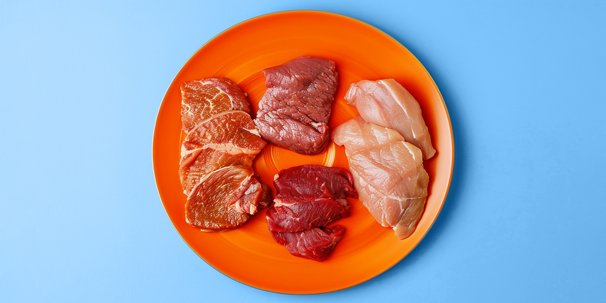 Different kinds of meat on a orange plate