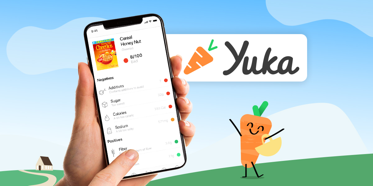 A hand holding a smartphone with the Yuka food scanning app on