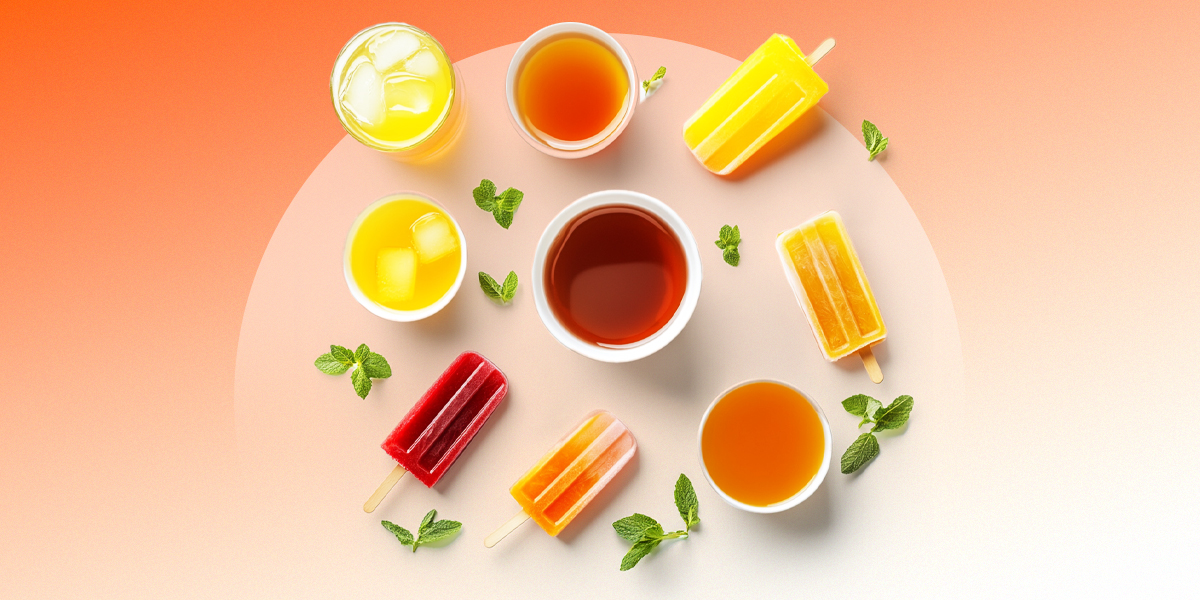 Mint, popsicles, sodas and ice cubes in orange background