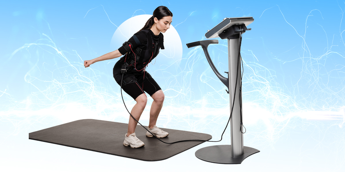 Person working out with ems machine hooked up