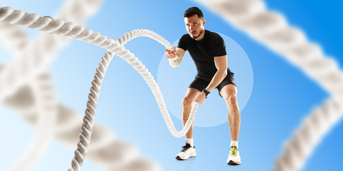 Person training with ropes in blue background