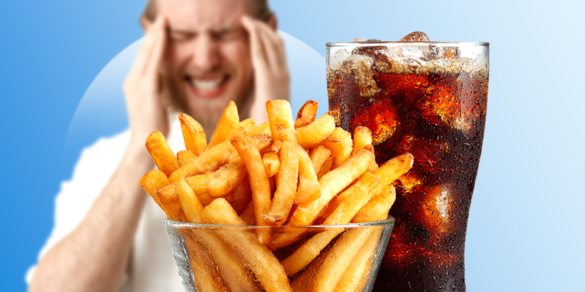 Person having migraine in background with mcdonalds food in front