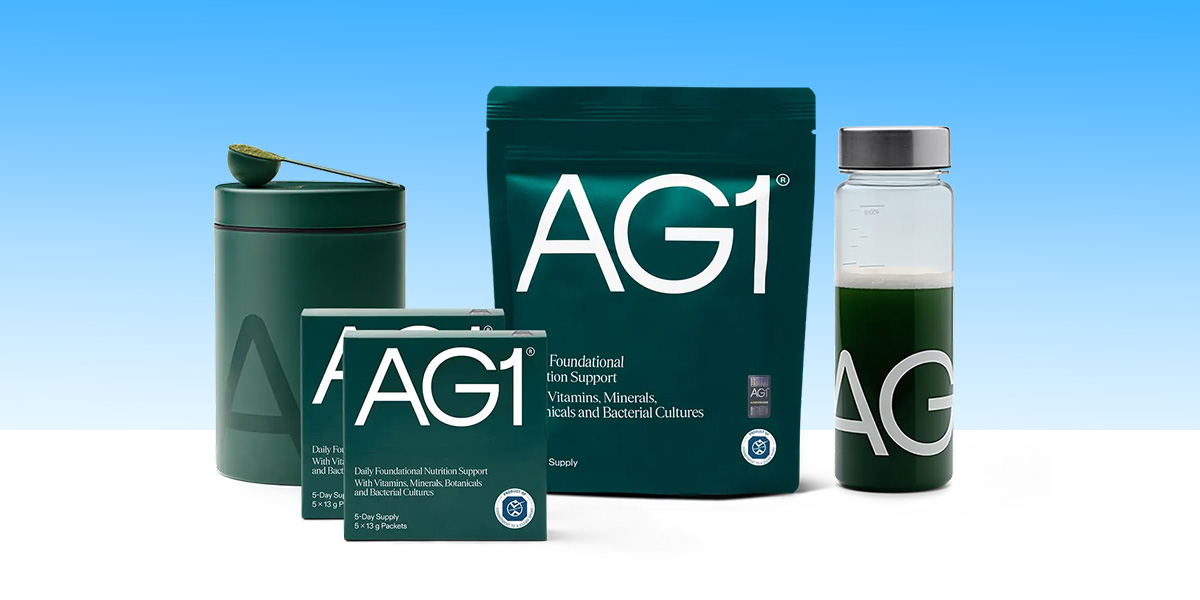 Pouches of AG1 supplemented and a branded water bottle