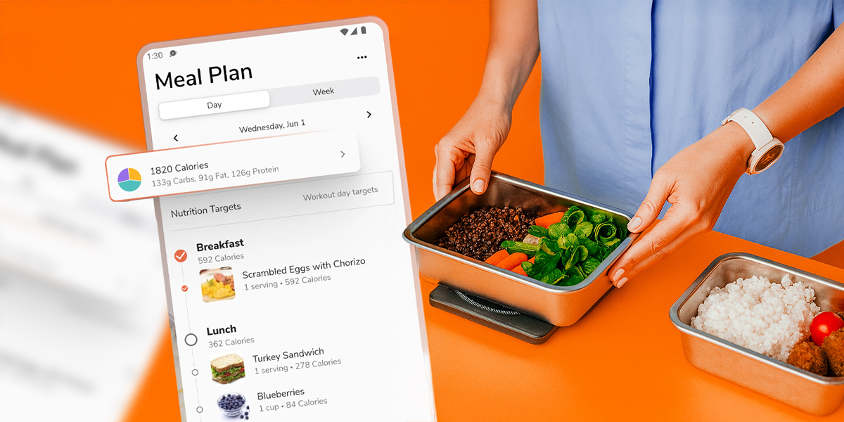 A smartphone with a meal planning app and a person preparing food