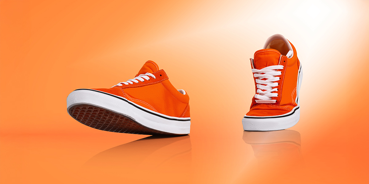 Orange shoes walking in background