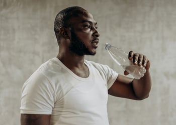 Black person drinking water