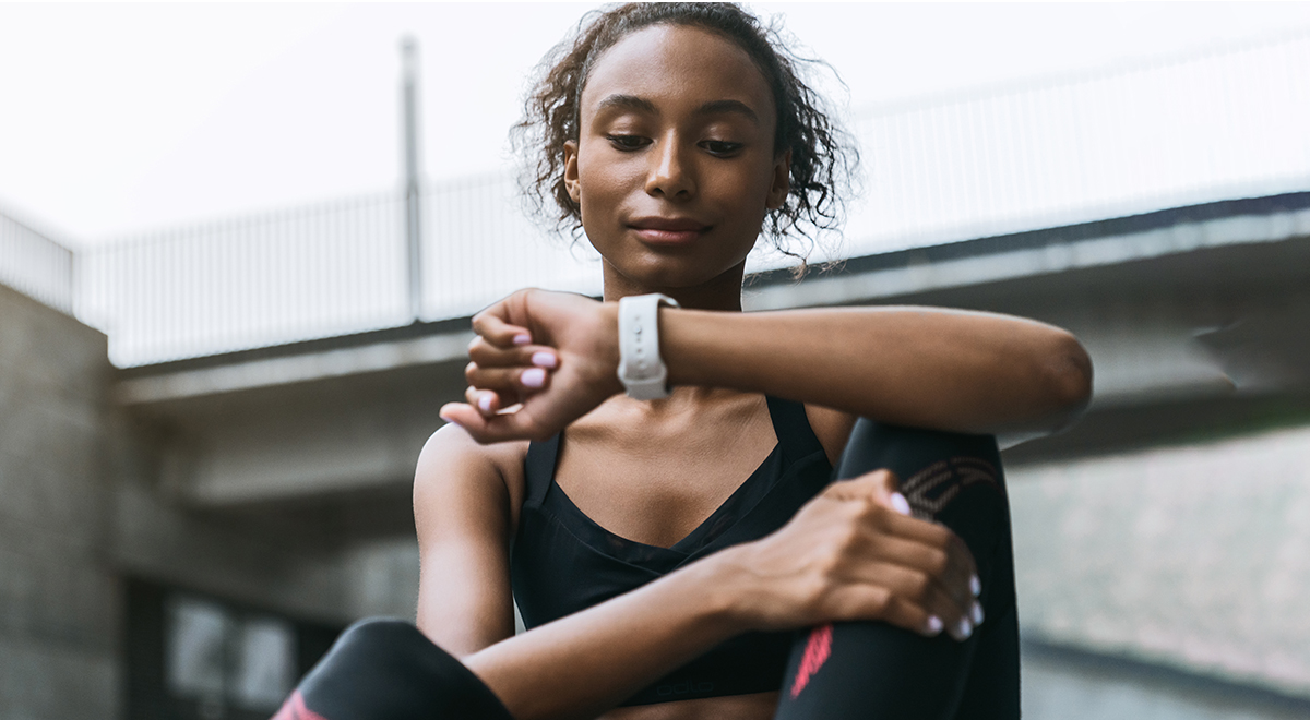 Black woman checking watch