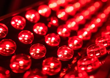 Close-up of a red light therapy lamp