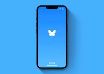 Bluesky app displayed on a mobile device against a blue background