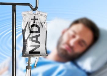 Image of person receiving Nad+ infusion for addiction treatment in a clinic