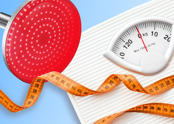 Red light therapy lamp and measuring tape with scales in blue background