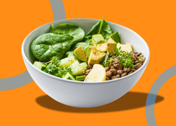 Bowl of lentils, avocado, and greens