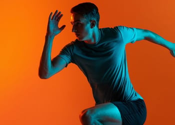 Man running wearing blue workout clothes