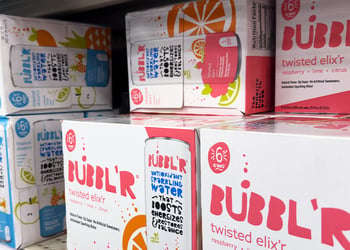 Cases of BUBBL'R sitting on store shelf