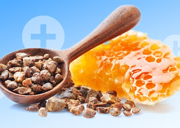 Propolis and beeswax products on the blue background