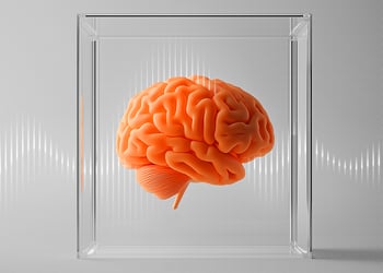 Orange brain in a glass cube with gray brain waves background