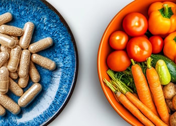 One bowl containing fiber supplements and another containing high-fiber veggies
