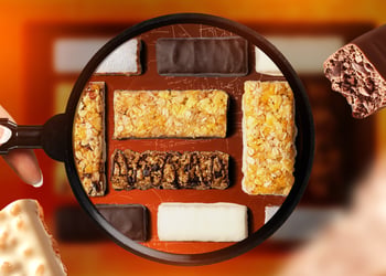 Protein bars of different kinds under a magnifying glass
