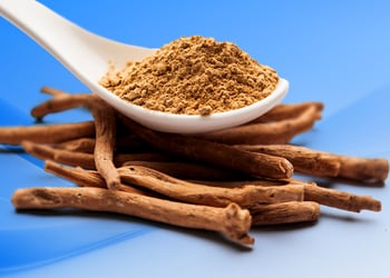 Ashwagandha in blue background with spoon