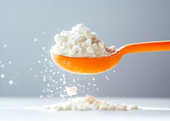 Orange spoon holding creatine