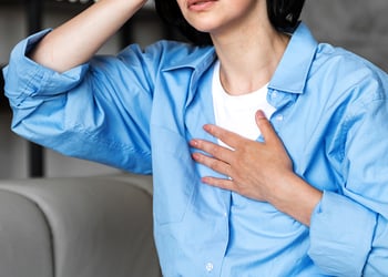 Person sitting on the couch checking homocystein levels