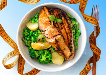 mediterranean diet food in a bowl with measuring tape around it
