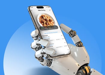 A robot's hand holding a smartphone with a SnapCalorie app open