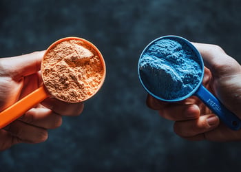 Two scoops of powders blue and orange