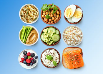 Low carb bowls of food in blue background