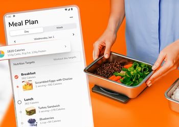 A smartphone with a meal planning app and a person preparing food