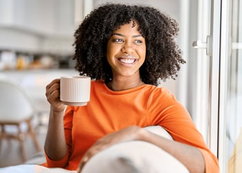Person drinking to detox cortisol