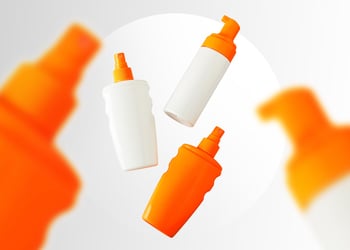 Four sunscreen bottles on a white background