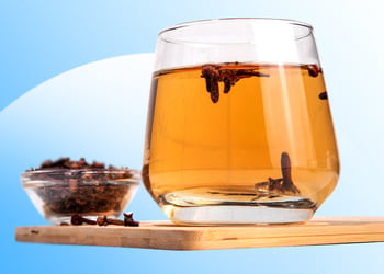 Clove water in a glass cup