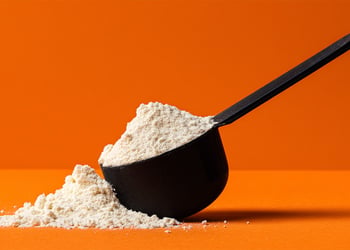 Black scoop full of powder